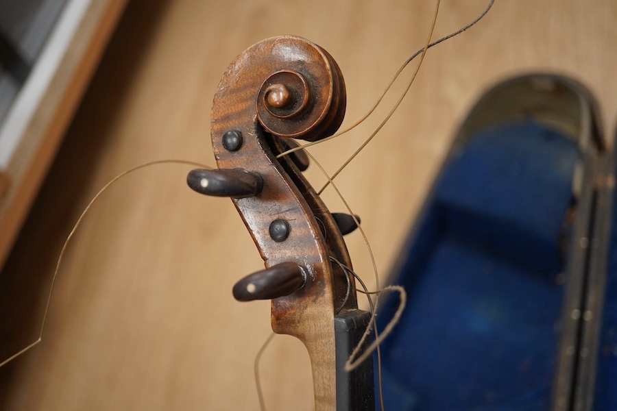 Two cased violins; one French 19th century bearing a hand written label for Francesco Werentle 1746, body length 35.5cm, the other an early 20th century violin, body length 35cm. Condition - poor.